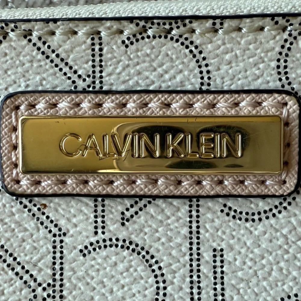 Calvin Klein Signature Pattern Wristlet in Cream and Tan